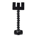 Black plastic pet photography clip holding a phone, with a rotating arm to grip dog or cat treats for photos.