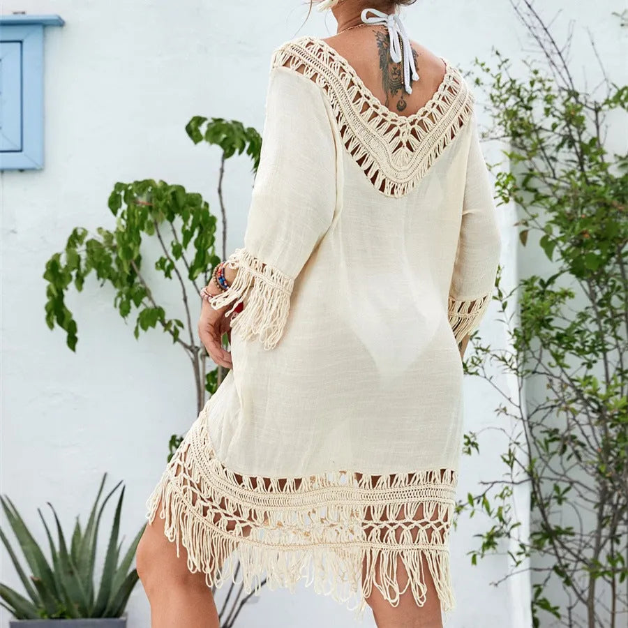 Apricot crocheted patchwork beach dress with half sleeves and mid-length cut on mannequin