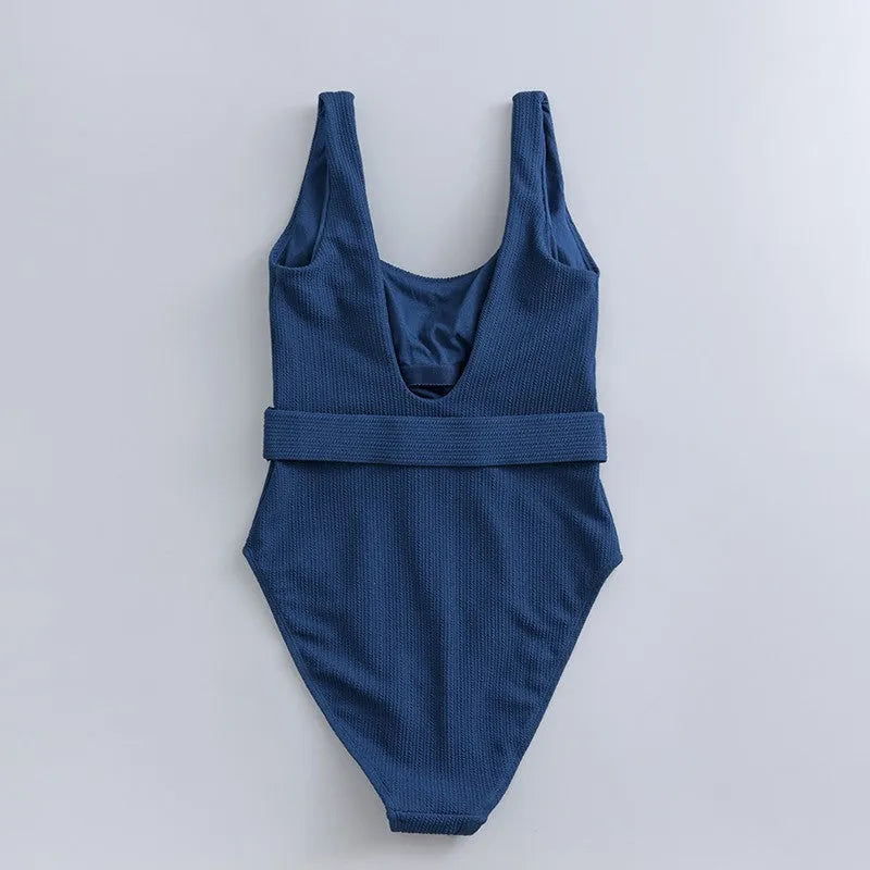 Navy blue women's one-piece swimsuit with triangle slimming shape and removable chest pads