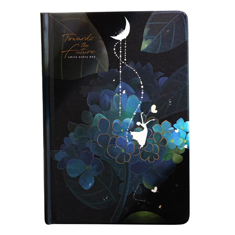 A5 size notebook with a luminous cover, open to show colour illustration pages and lined 160gsm paper.