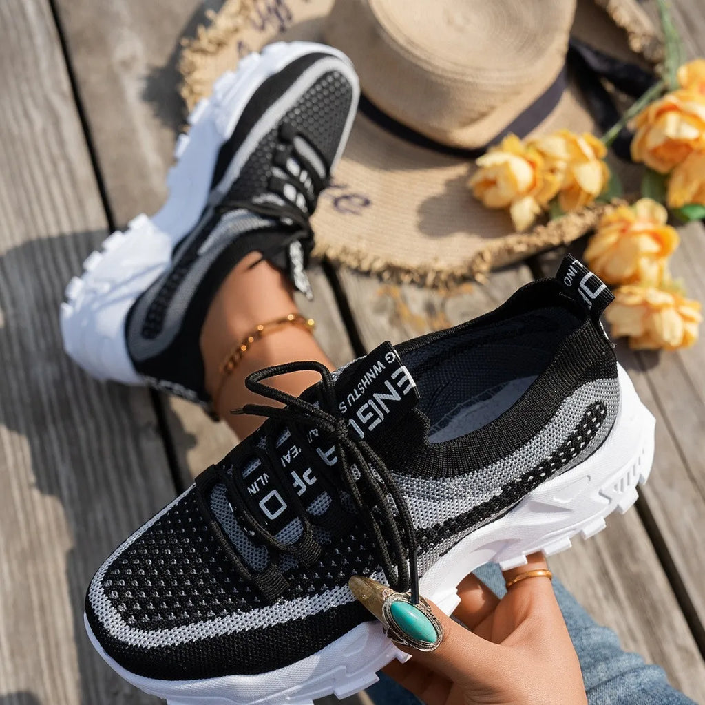 Women's Flyknit mesh lace-up sneakers in various colours on a flat rubber sole.
