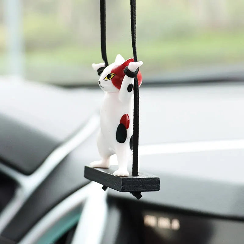 Cartoon-style resin cat pendant for car interior decoration with an adjustable rope, shown in black colour