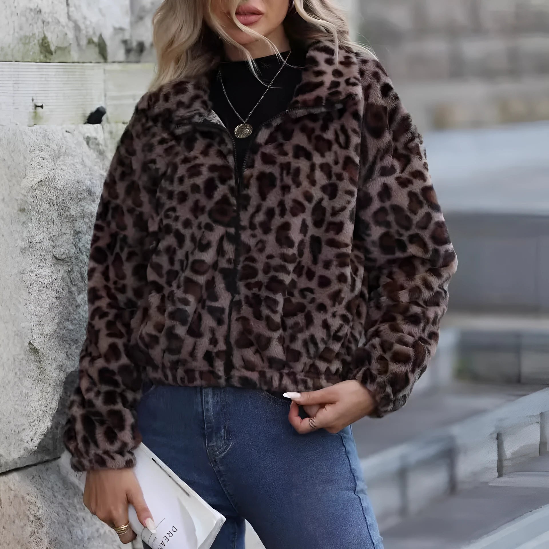 Women's loose-fitting leopard print plush coat with front zipper and raglan sleeves.