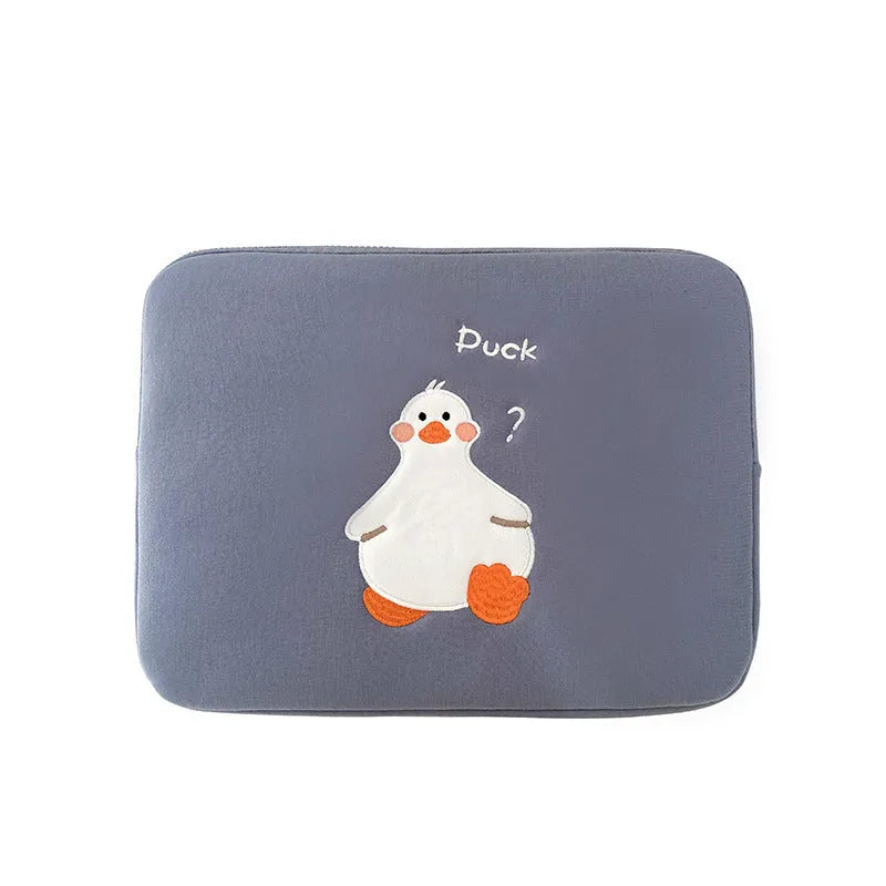 Blue cotton tablet case with embroidered cartoon duck design and a zipper, sized for an iPad.