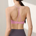 Women's high-strength nylon sports vest for running and yoga in black colour with double-shoulder straps.