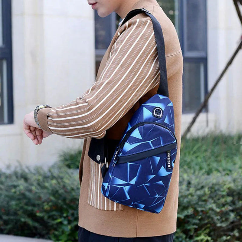 Blue print sling chest crossbody bag for men with an earphone hole and zipper opening.