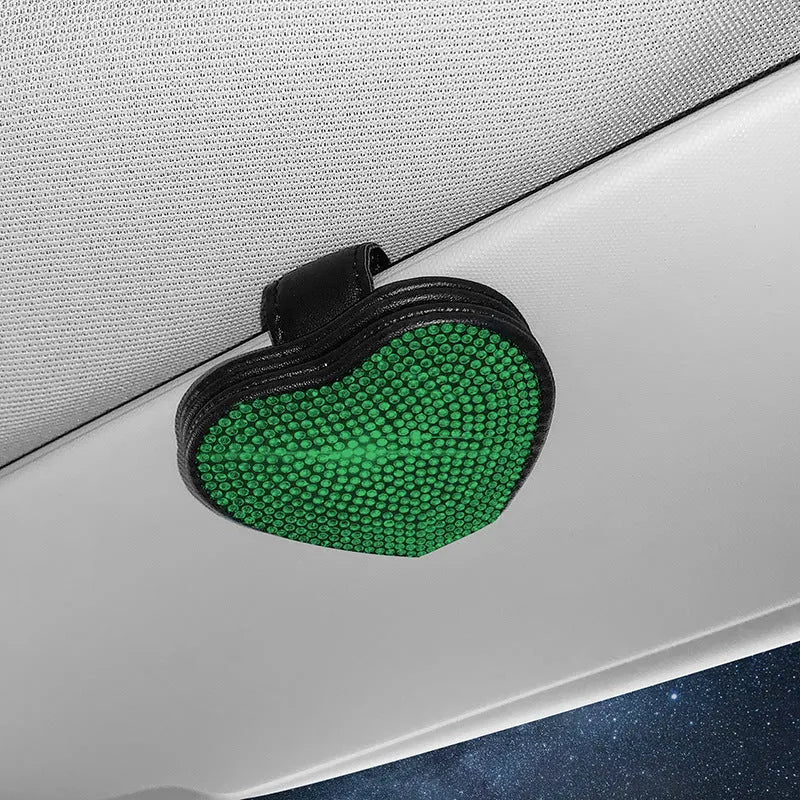 Black diamond-encrusted PU leather car sun visor clip holding sunglasses and a ticket.