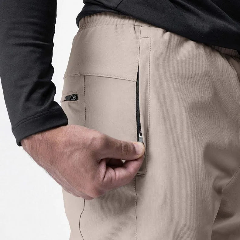 Men's dark grey quick-dry ankle-tie fitness pants shown in a loose fit.