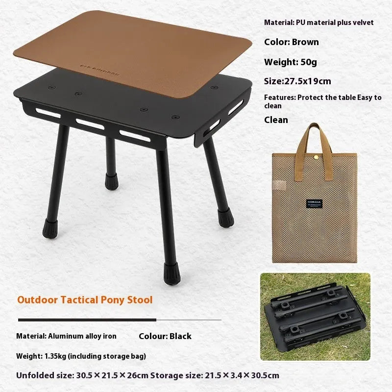 CLS aluminium folding camping stool shown in army green, converted into a small raised table next to a storage bag.