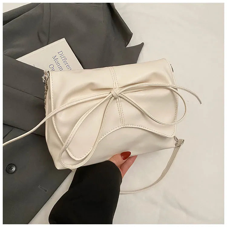 Women's black PU leather crossbody bag with square shape and sewing line detailing