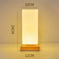 Nordic solid wood USB table lamp with white flower-shaped light and touch controls