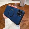 Black imitation leather magnetic charging case for Apple iPhone on a magnetic charging stand.