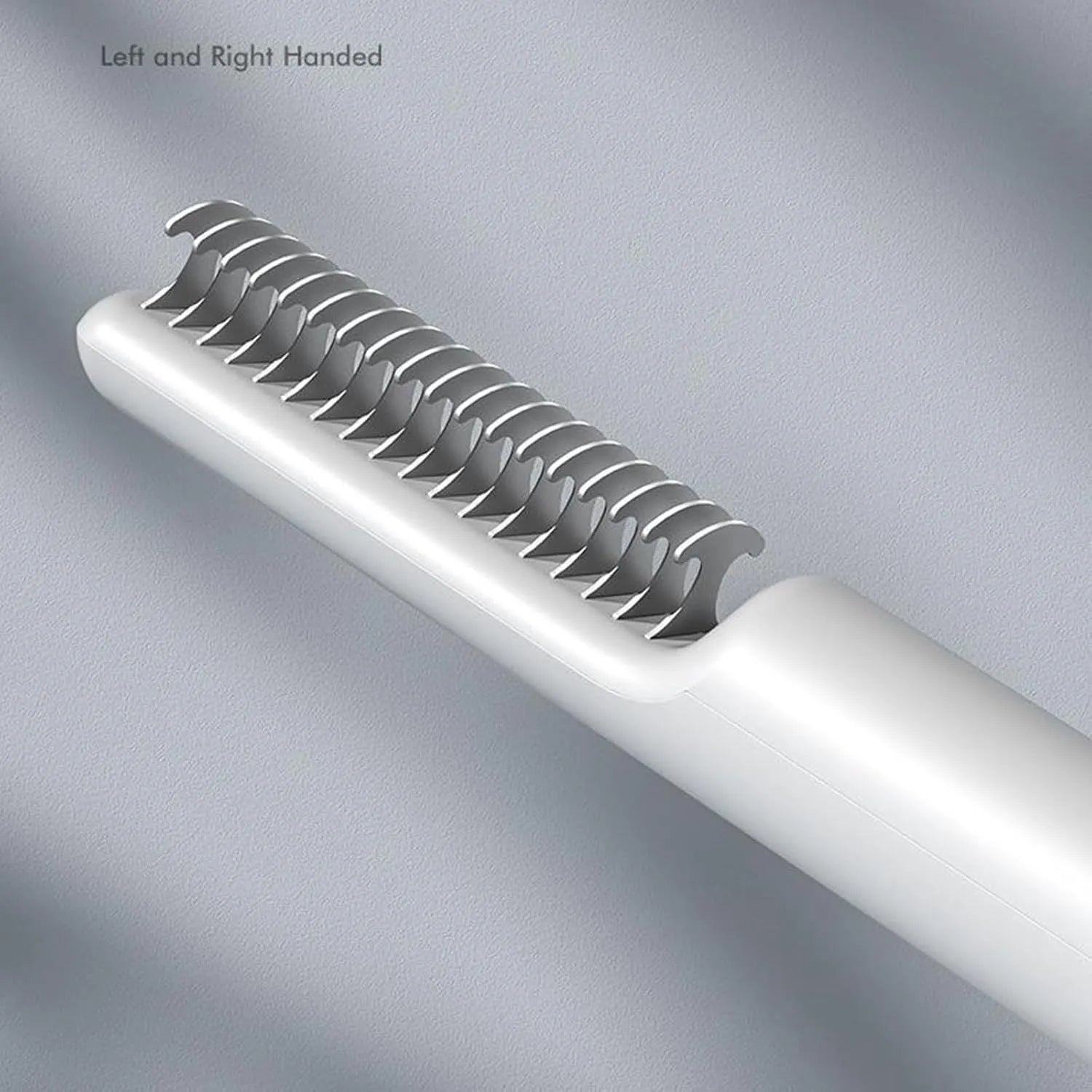 Stainless steel pet dematting comb with handle for removing knots and mats from dog's coat.