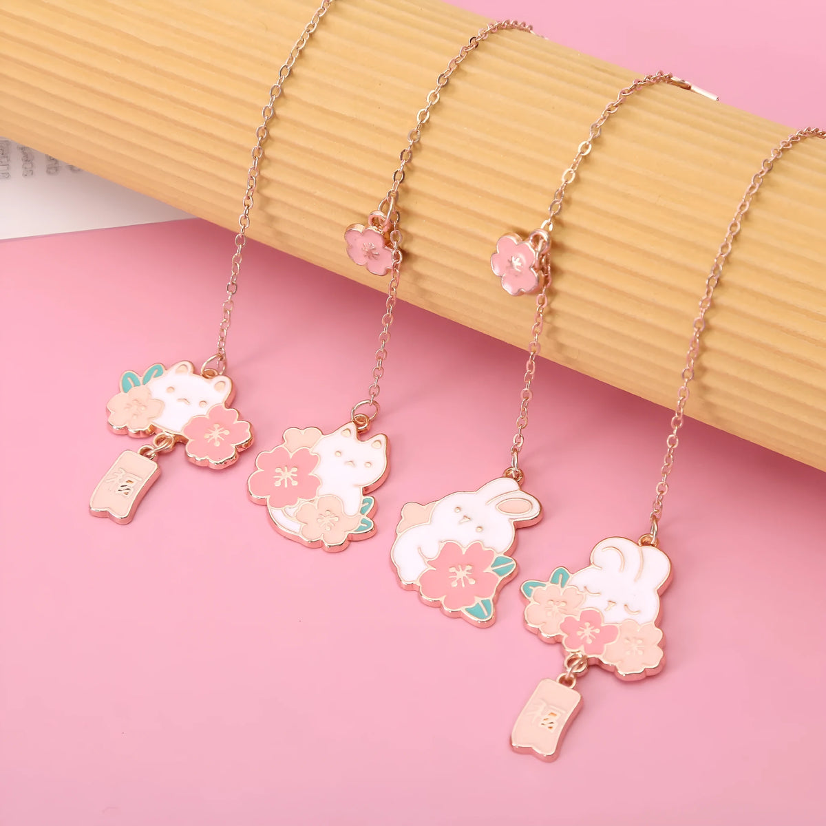 Metal pendant bookmark with cartoon cherry blossom cat and rabbit designs for books and journals