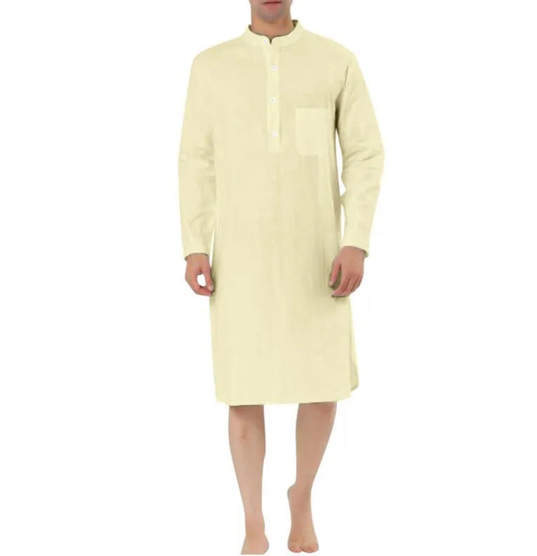 Man wearing a light blue cotton shirt robe with a simple chest pocket.