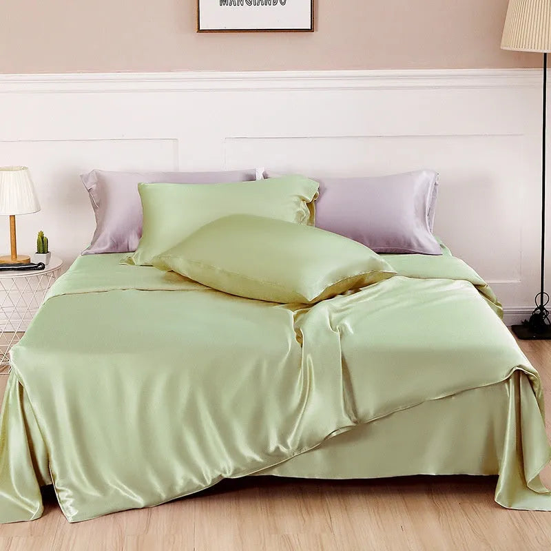 Double-sided solid colour silk duvet cover shown in multiple colour options.