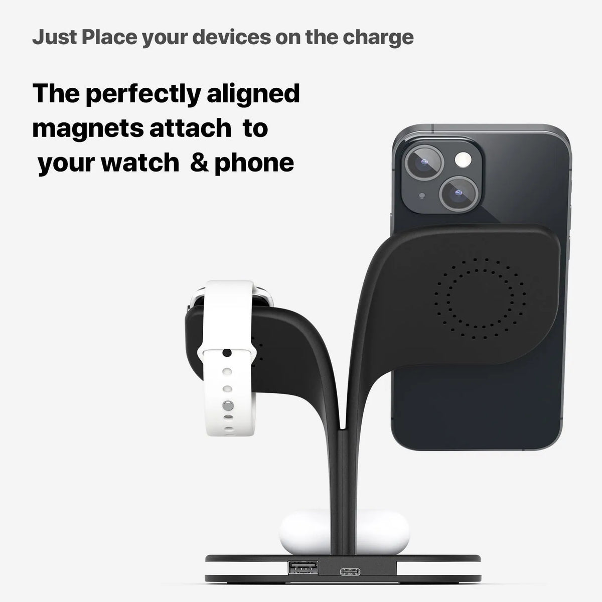 Black and white wireless charging station for phone, watch and headphones on a desk