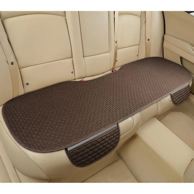 Linen car cushion with hemmed edges in charm coffee colour on vehicle seat