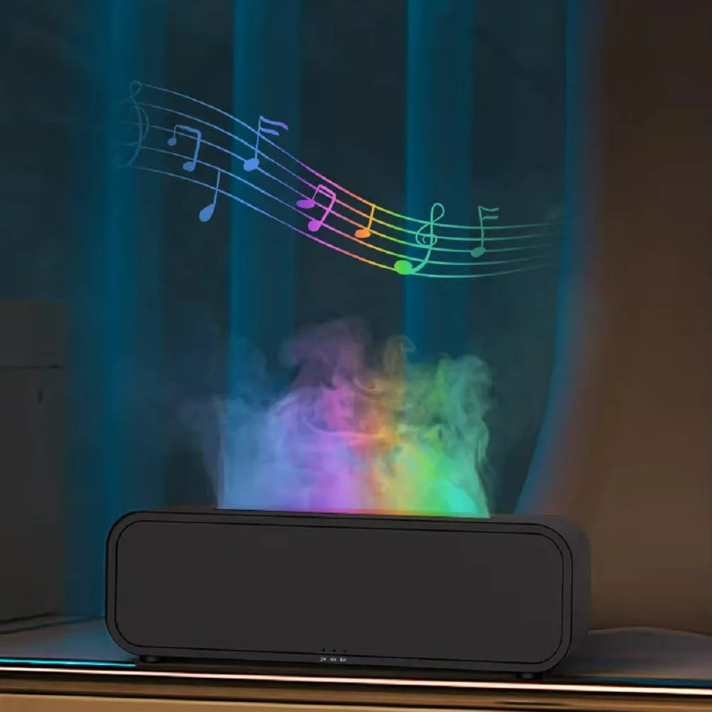 Black and white essential oil diffuser with flame effect and colour-changing lights next to remote control