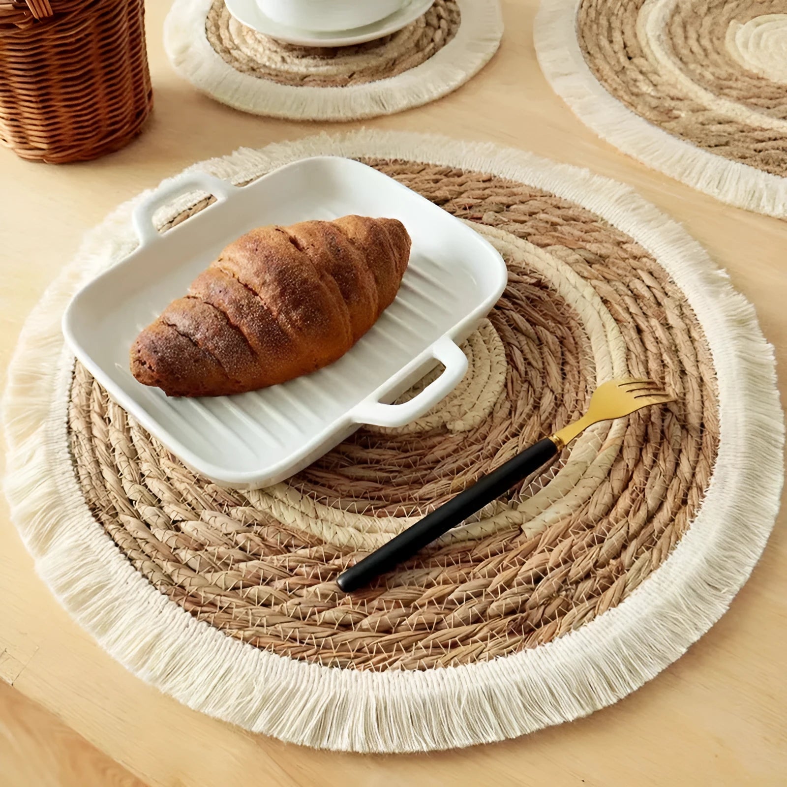 Round Japanese placemat made from natural papyrus with decorative tassels in modern simple style