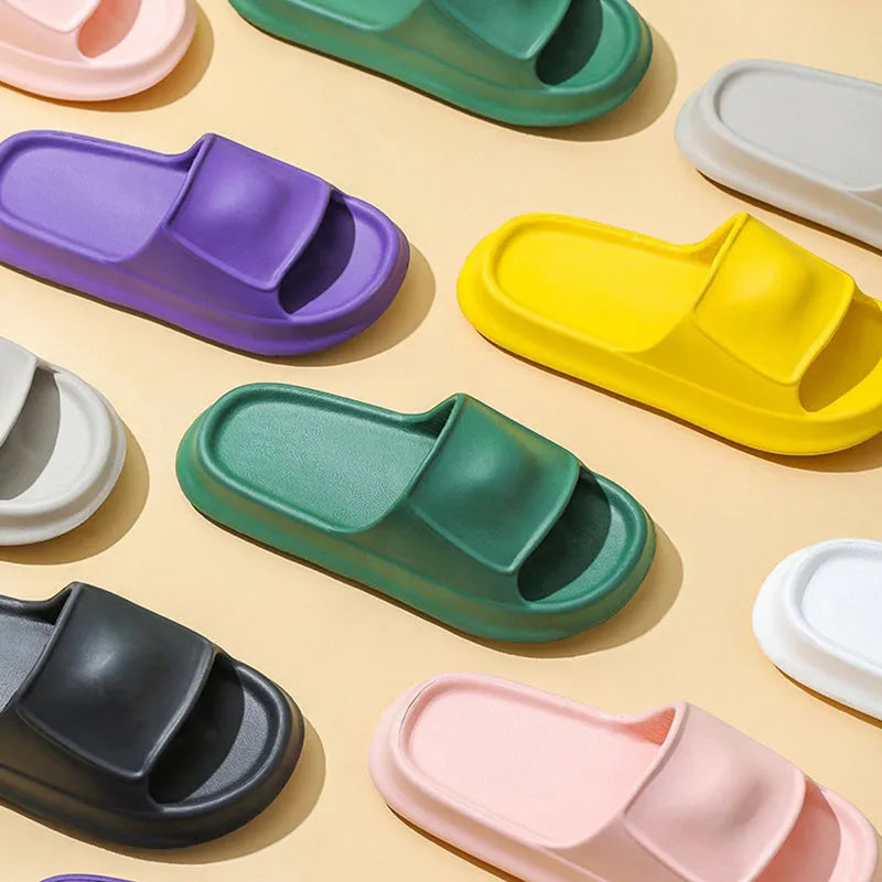 Unisex thick-soled EVA flip-flop slippers in multiple colours on a white background.