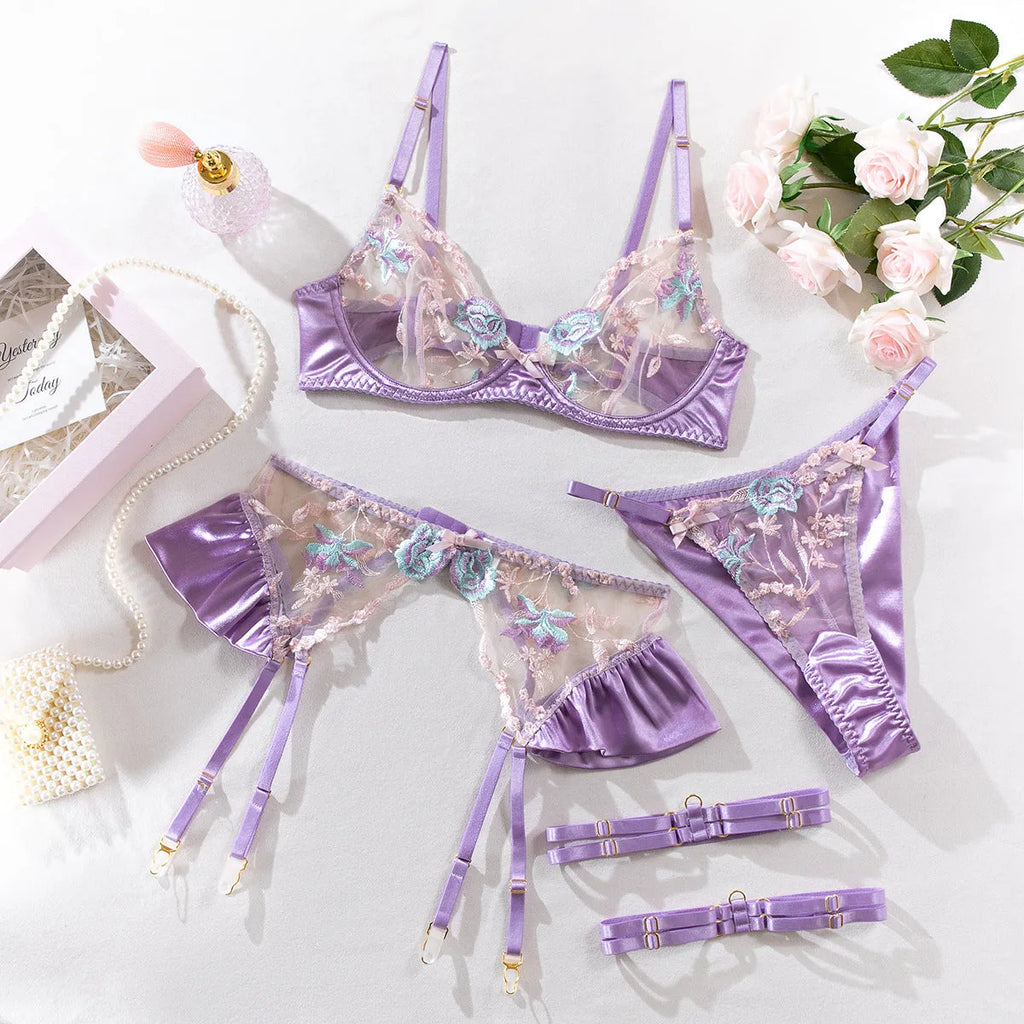 Light purple satin lingerie four-piece set with embroidery detail, shown alongside champagne colour option.
