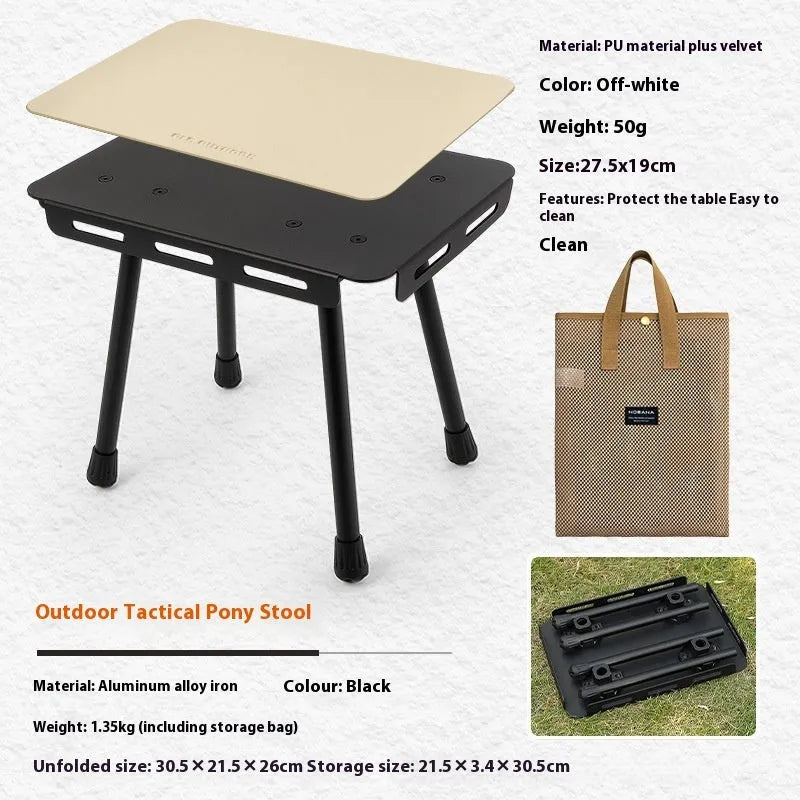 CLS aluminium folding camping stool shown in army green, converted into a small raised table next to a storage bag.
