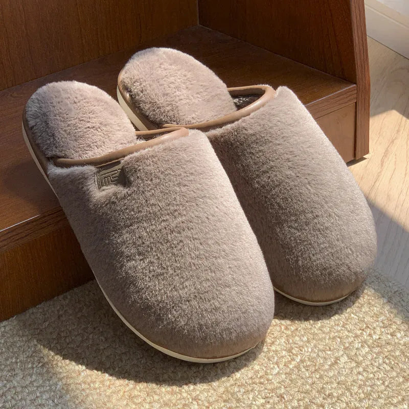 A pair of solid colour plush winter slippers with a non-slip PVC sole, shown in available colours.