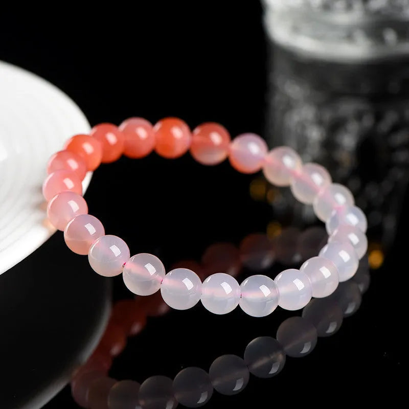 Yanyuan agate bracelet with gradient colours showing beads in a geometric style on a wrist.