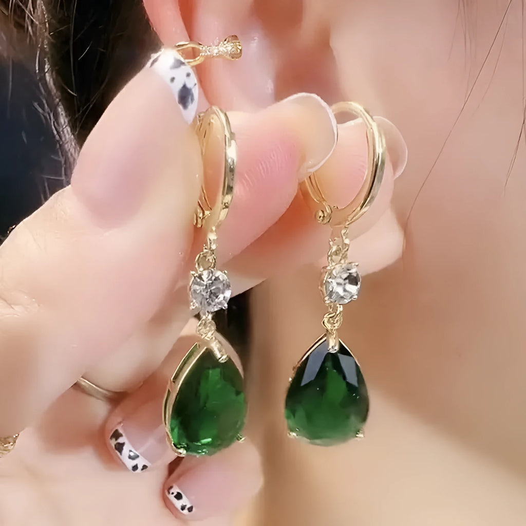 A pair of green geometric teardrop-shaped alloy earrings.