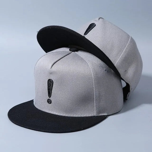 Cotton baseball cap with embroidered exclamation mark, adjustable dome crown, in black