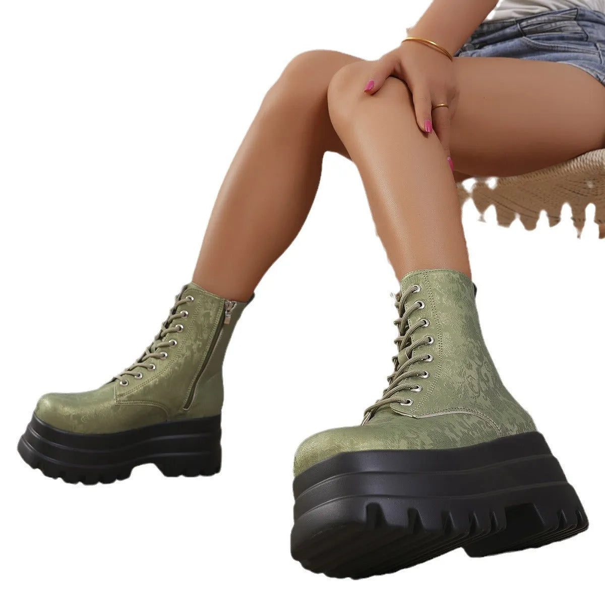 Women's white retro platform Martin boots with side zip and chunky heel on a plain background.