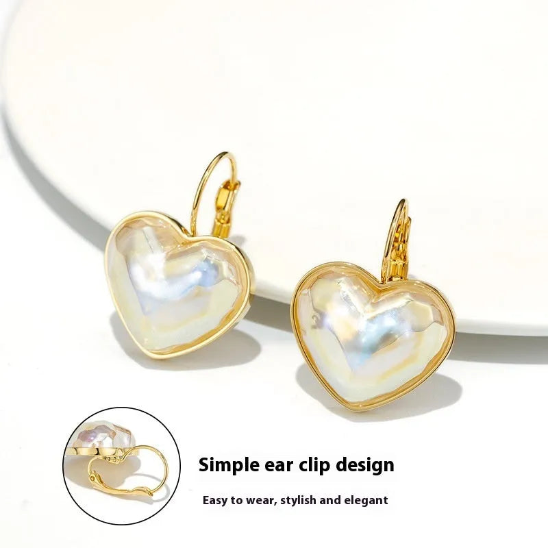 A pair of gold-coloured alloy clip-on earrings for women in a natural style.