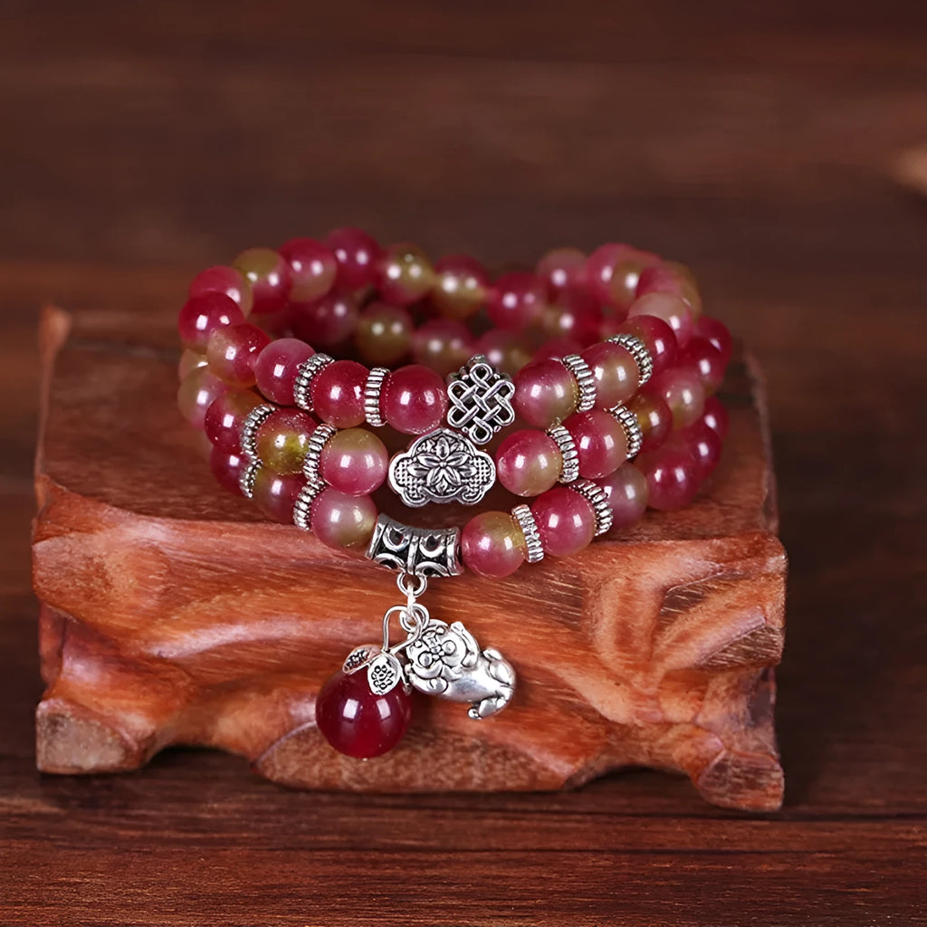Handmade watermelon crystal Chinese knot bracelet with traditional geometric designs in 8mm and 6mm elephant style sizes