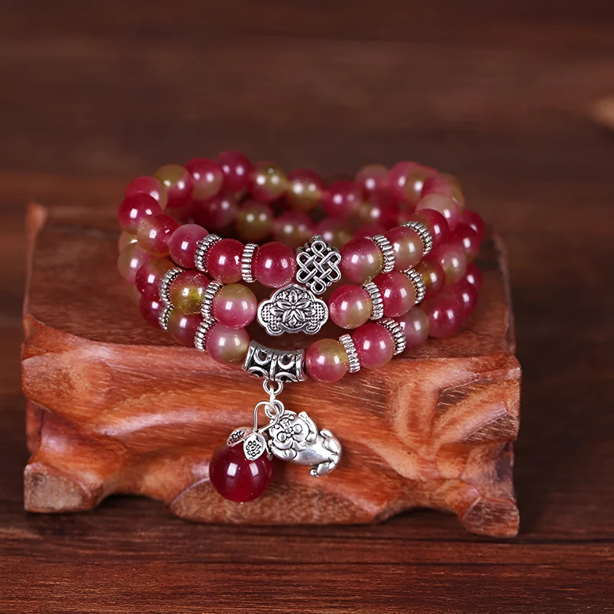 Handmade watermelon crystal Chinese knot bracelet with traditional geometric designs in 8mm and 6mm elephant style sizes