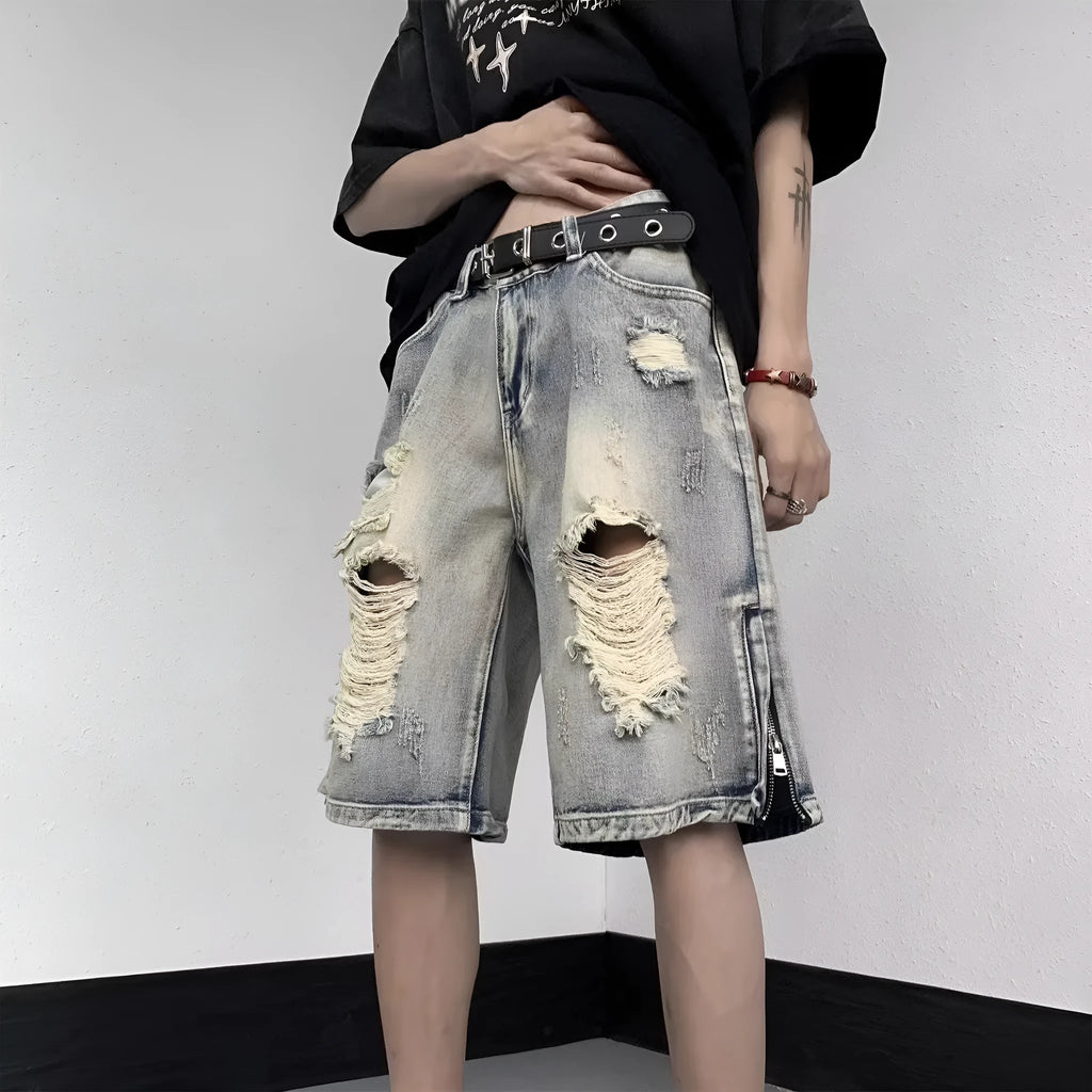 Blue retro denim shorts with a tattered finish and loose wide-leg cut on a mannequin