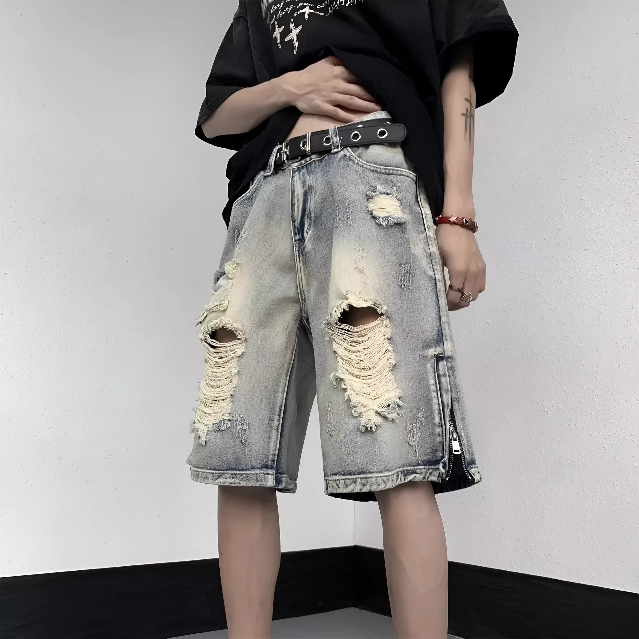 Blue retro denim shorts with a tattered finish and loose wide-leg cut on a mannequin
