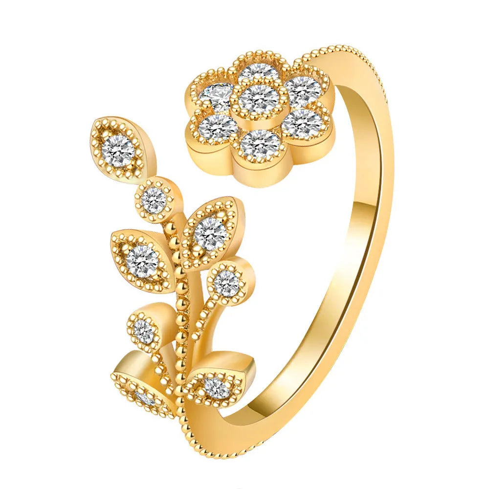 Women's copper open ring with a diamond-faceted flower and leaf design in gold and white colour options.