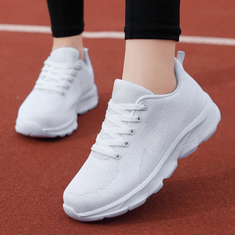 Women's lightweight mesh breathable running shoes with wedge heel in black upper side view