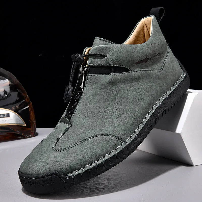 Men's black casual leather shoes with round toe, tall crown, and rubber sole.