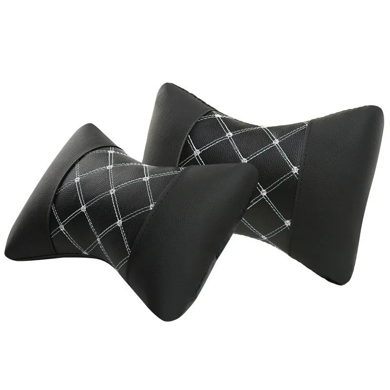 Black leather quilted car headrest pillow with diamond pattern and contrasting stitching