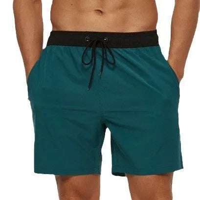 Men's blue athletic shorts with stitching waistband, drawstring and headband for running