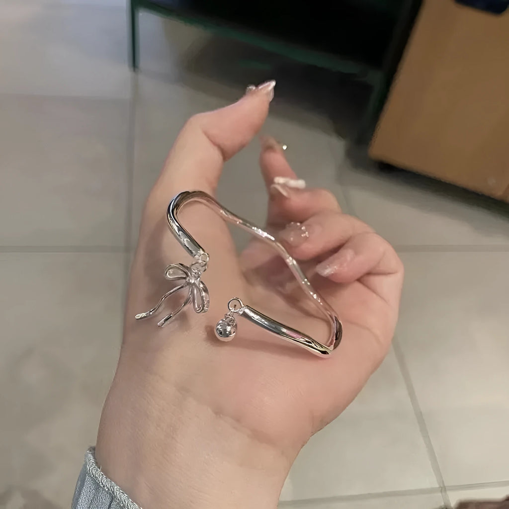 Silver adjustable bow bell opening bracelet made from zinc alloy