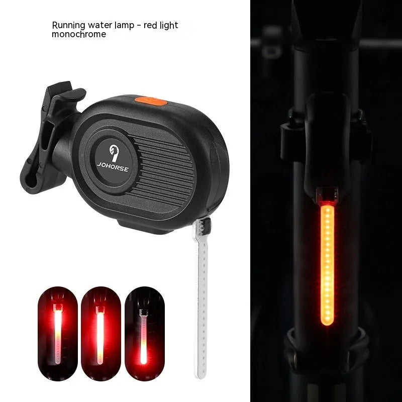 Bicycle tail light showing blue running waterfall light effect on a black background