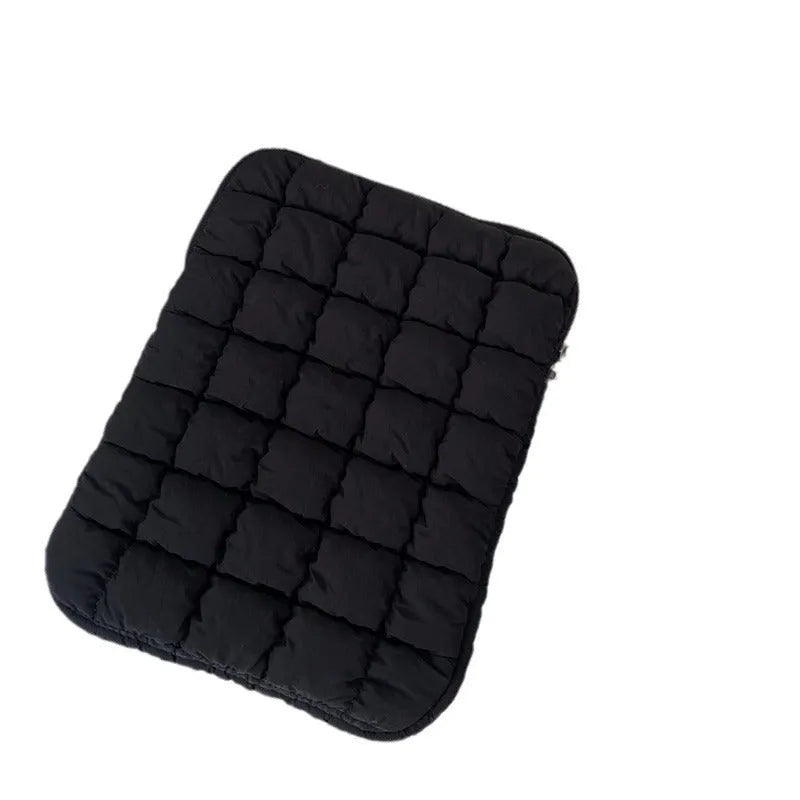 Black nylon laptop backpack open to show dedicated computer compartment with cloud cotton shoulder straps