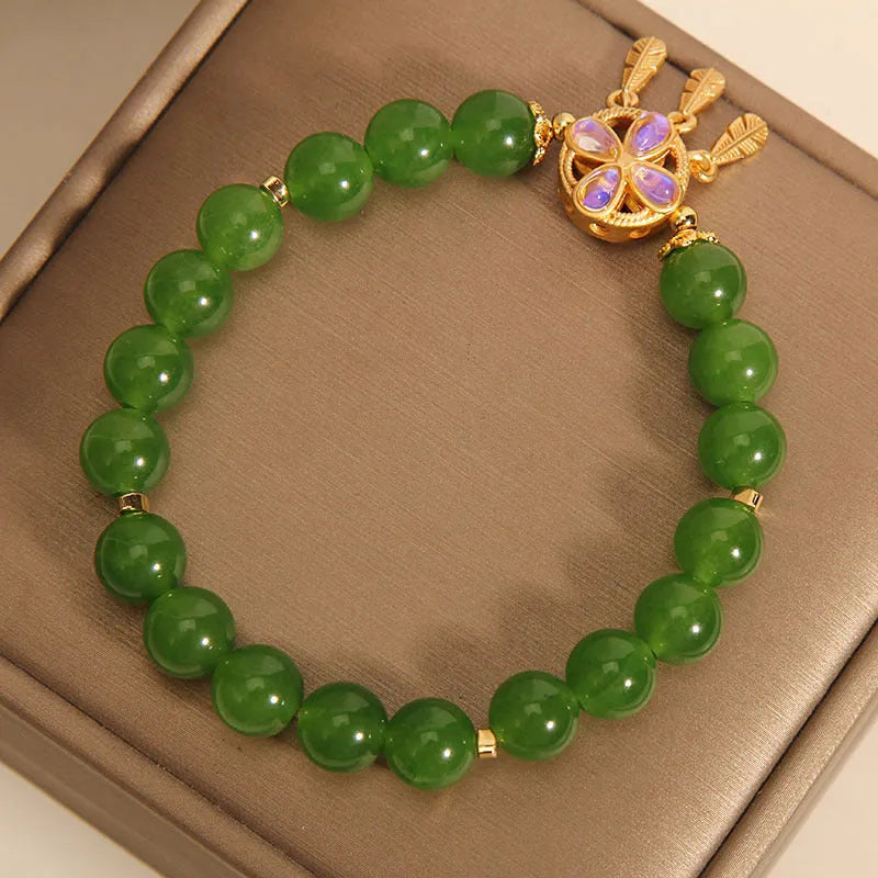 Original women's bracelet with a green jasper crystal four-leaf clover dream catcher pendant.