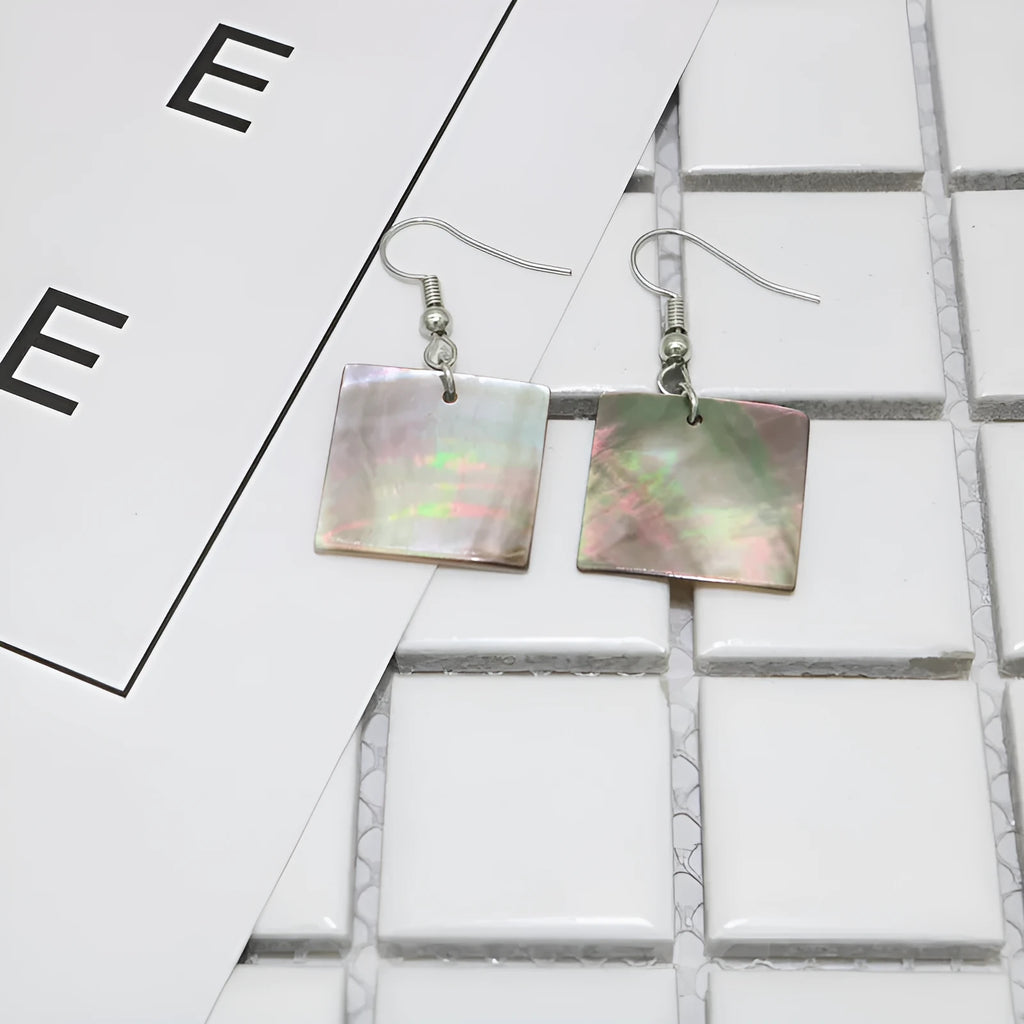 Geometric shell earrings in square panther or rectangular shell styles with natural material texture