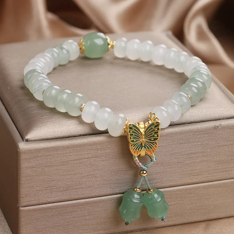 Green women's bracelet with Tian Shan Cui abacus beads and retro butterfly tassel design