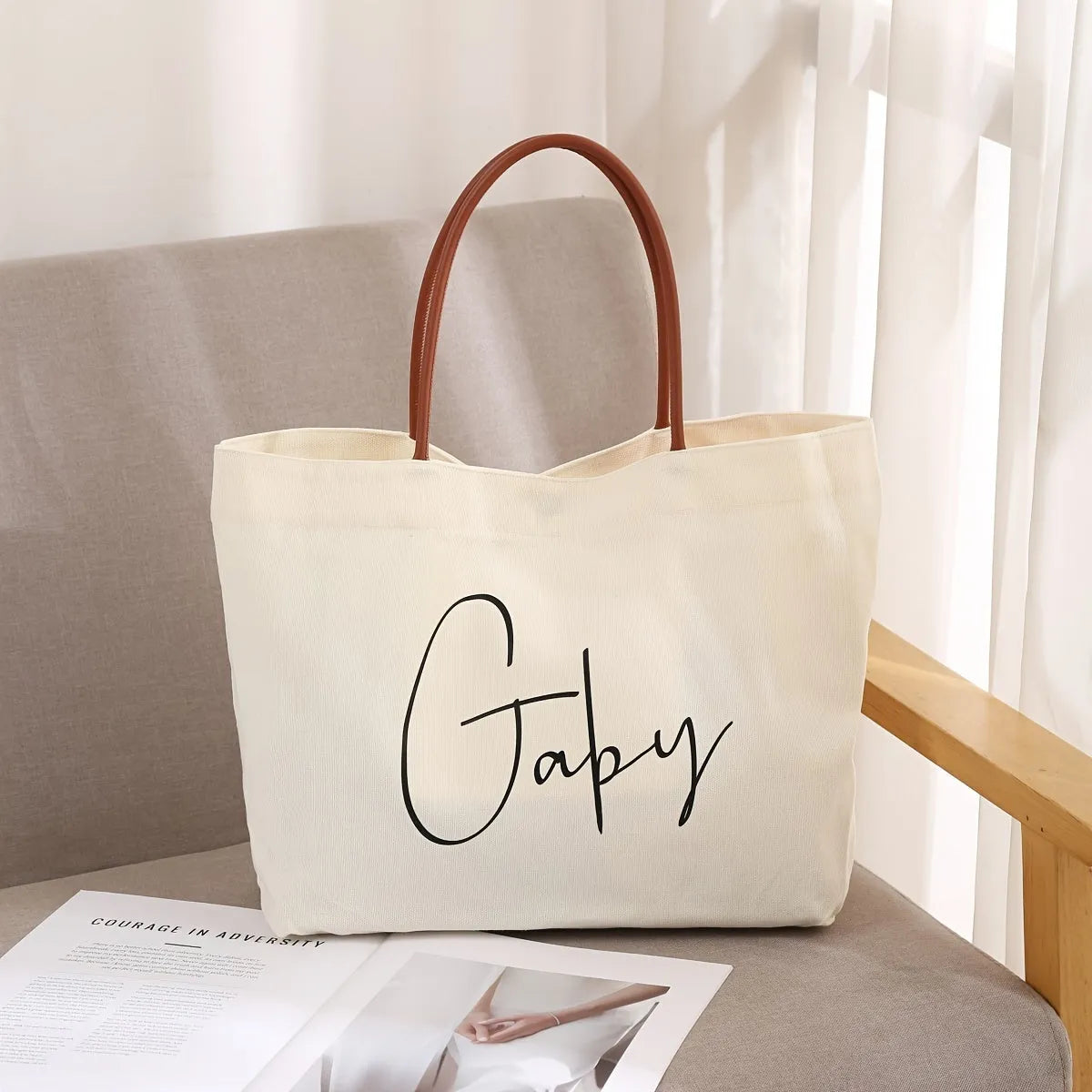 Large beige white canvas tote bag with a reinforced flat base and roomy interior.