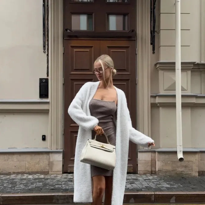 White long knitted cardigan jacket on a model, showing loose fit and 105cm length.